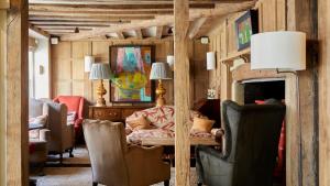 a living room with a couch and chairs at The George In Rye in Rye