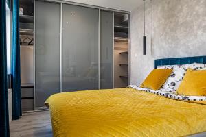 Posteľ alebo postele v izbe v ubytovaní Luksusowy apartament na Starym Miescie