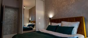 Posteľ alebo postele v izbe v ubytovaní Luksusowy apartament na Starym Miescie