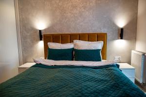 Posteľ alebo postele v izbe v ubytovaní Luksusowy apartament na Starym Miescie
