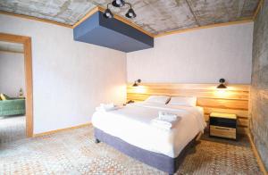 Postel nebo postele na pokoji v ubytování Hotel Posta