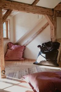 a attic room with two pillows on the floor at Auenhütte in Hirschegg
