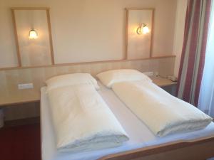 Letto o letti in una camera di Pension Bergblick