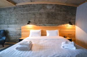 Postel nebo postele na pokoji v ubytování Hotel Posta