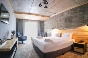 Postel nebo postele na pokoji v ubytování Hotel Posta
