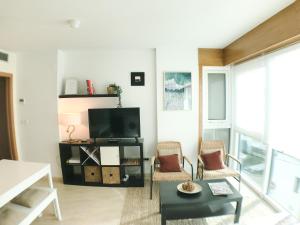 Imagen de la galería de Apartamento estilo costero al lado de la playa, en Goyanes