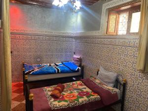 a bedroom with two beds in a room at Downtown Fez Hostel in Fès