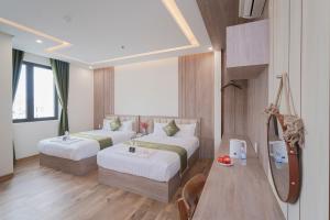 Katil atau katil-katil dalam bilik di Maris Da Nang Hotel & Apartment