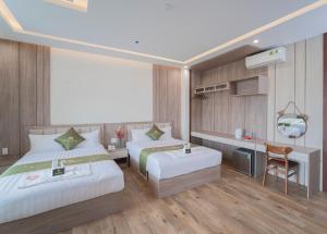 Katil atau katil-katil dalam bilik di Maris Da Nang Hotel & Apartment