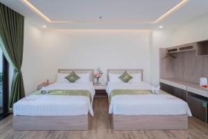 Katil atau katil-katil dalam bilik di Maris Da Nang Hotel & Apartment