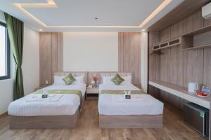 Katil atau katil-katil dalam bilik di Maris Da Nang Hotel & Apartment