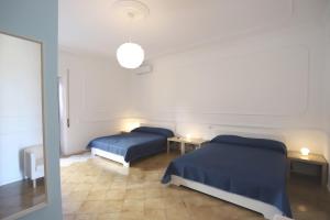 A bed or beds in a room at Bianco Latte