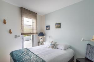 Łóżko lub łóżka w pokoju w obiekcie ILLANKA - Appartement 3 chambres avec parking et terrasse proche gare