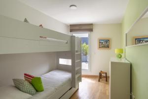 Łóżko lub łóżka w pokoju w obiekcie ILLANKA - Appartement 3 chambres avec parking et terrasse proche gare