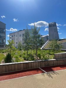 a view of a park with trees and buildings at The Seaside Apartment Turku in Turku