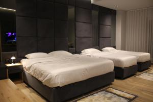 Un ou plusieurs lits dans un hébergement de l'établissement Hotel-VH