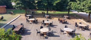 a group of tables and chairs in a park at Agrilocanda Val Campotto in Argenta