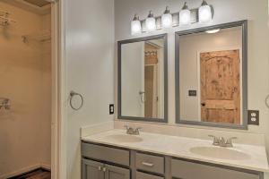 a bathroom with two sinks and two mirrors at Pet-Friendly Mechanicsville Retreat with Deck! in Mechanicsville +25 photos