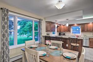 a kitchen and dining room with a table and chairs at Seneca Falls Retreat - Near Cayuga Wine Trail in Seneca Falls