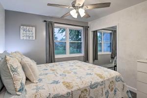 1 dormitorio con 1 cama y ventilador de techo en Seneca Falls Retreat - Near Cayuga Wine Trail, en Seneca Falls