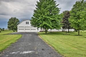 a white barn with a driveway and trees at Cozy Seneca Falls Home Close to Cayuga Wine Trail! in Seneca Falls +20 photos