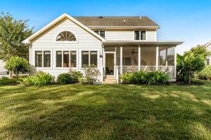 a white house with a large yard at Salt Pond - 233 Oyster Shell in Bethany Beach