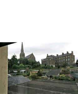 a view of a city with a church and buildings at Townhouse Wexford in Wexford