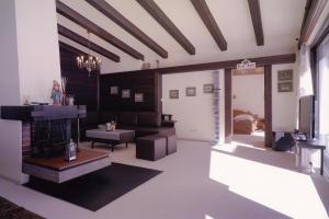 a living room with a couch and a fireplace at Apartment Familie Kinz im Haus Zalim in Brand