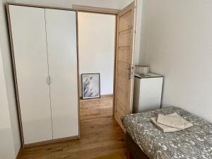 Posteľ alebo postele v izbe v ubytovaní Apartament NOTI Gdynia z parkingiem