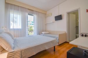 Postel nebo postele na pokoji v ubytování Hotel Janeiro + 37 fotografií