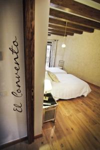 Postel nebo postele na pokoji v ubytování Posada Real del Buen Camino