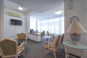 TV a/nebo společenská místnost v ubytování Hotel Janeiro