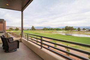 a balcony with a view of a golf course at Villa 22 a Fairway to Heaven, brand new listing! Stunning Views! in St. George