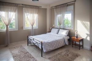 Ένα ή περισσότερα κρεβάτια σε δωμάτιο στο Ioannina Cozy Retreat