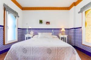 מיטה או מיטות בחדר ב-Ático El Pasero con Solarium y Barbacoa