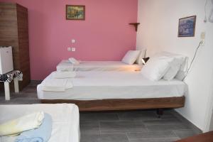 Letto o letti in una camera di Metapontis Studios (Nimporio)