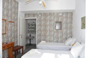 Letto o letti in una camera di Metapontis Studios (Nimporio)