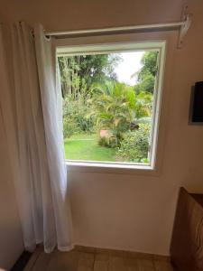Uma TV ou centro de entretenimento em Pousada Casa Azul
