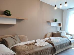 Кровать или кровати в номере Royal Relax Apartman