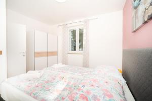Postel nebo postele na pokoji v ubytování Apartments Oriana