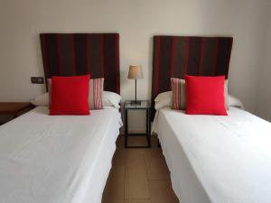 Posteľ alebo postele v izbe v ubytovaní Apartamento Puerta del Arenal - Kainga Homes