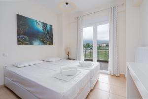 Postel nebo postele na pokoji v ubytování Villa Dias