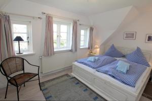 Ένα ή περισσότερα κρεβάτια σε δωμάτιο στο Karkstieg 6_ Whg_ 2_ Vogtum