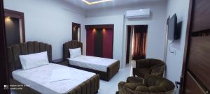 Ένα ή περισσότερα κρεβάτια σε δωμάτιο στο Travelodge Guesthouse