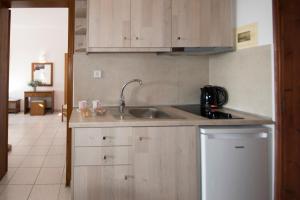a kitchen with a sink and a counter top at Galini in Agia Irini Milos