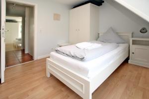 Ένα ή περισσότερα κρεβάτια σε δωμάτιο στο Wiesenweg 4a, Whg 2