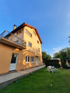 a house with a lawn in front of it at Dona 2 in Sarajevo +4 photos