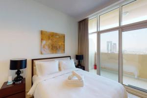Postel nebo postele na pokoji v ubytování Key View - Ghalia Tower