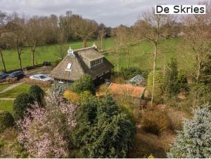 an aerial view of a house in a field at B&B De Flecht - De Skries in Nijega