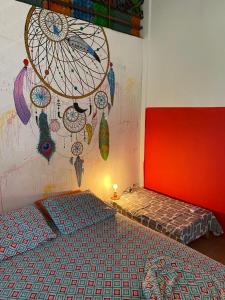 Ein Bett oder Betten in einem Zimmer der Unterkunft Zebulo Hostel